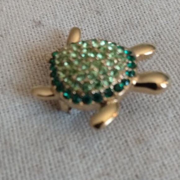Monet Jewelry - Monet: Gold tone light and dark green rhinestone small turtle brooch.